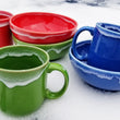 Load image into Gallery viewer, Red, Green, Blue mugs and bowls in Snowcap by The Fiesta Tableware Company
