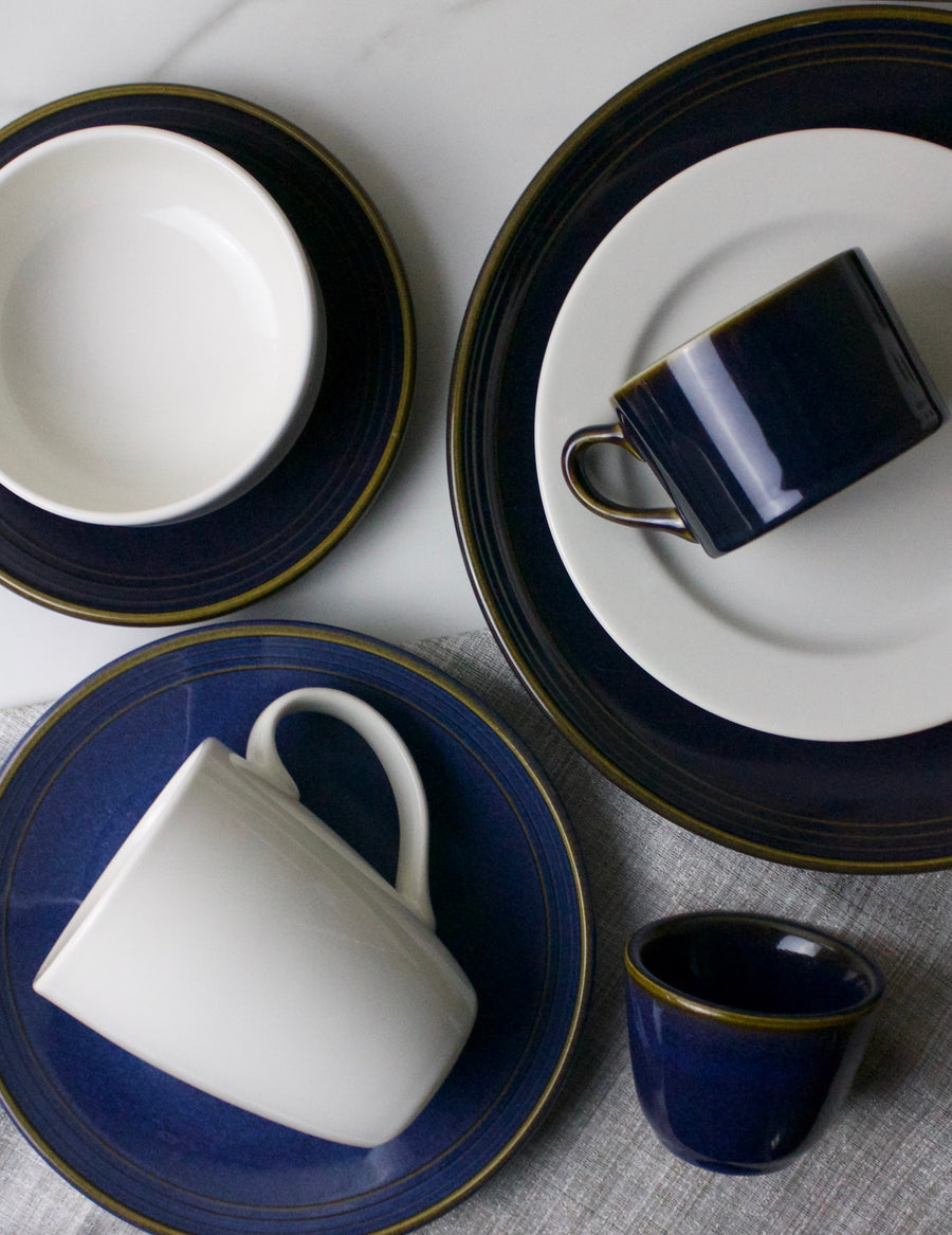 Indigo Empire Cup matched with Lienzo dinner ware on marble table